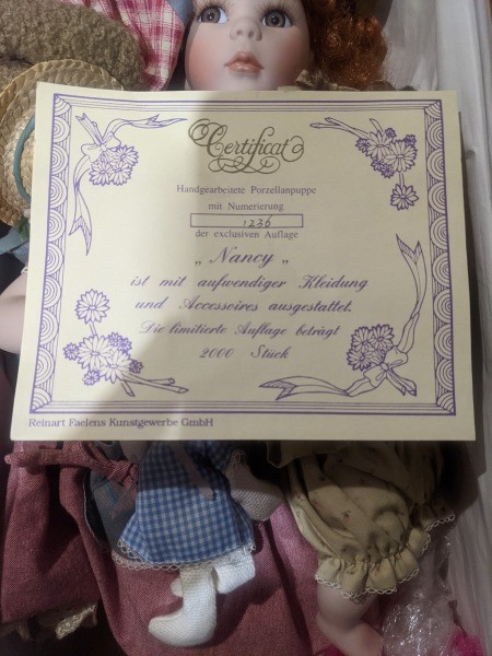 The certificate that came with a porcelain doll.