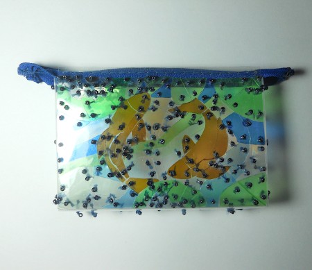 Adding the zipper to the pouch.