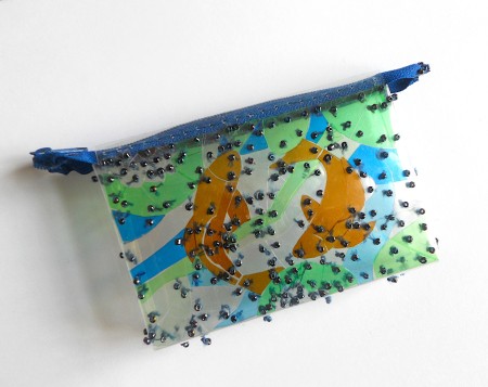 Adding the zipper to the pouch.