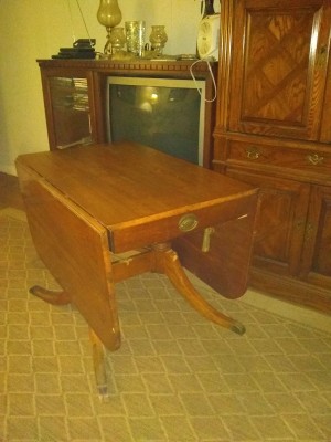 A mahogany table in an old fashioned room.