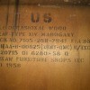 Information stamped on the underside of a table.