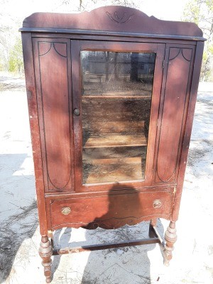 A wooden china cabinet.