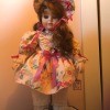 A porcelain doll in a modern dress.