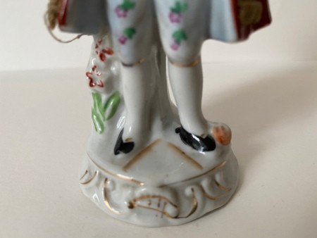 A closeup of the figurine's feet.