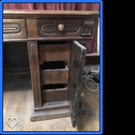 The open cabinet on an old wooden desk.