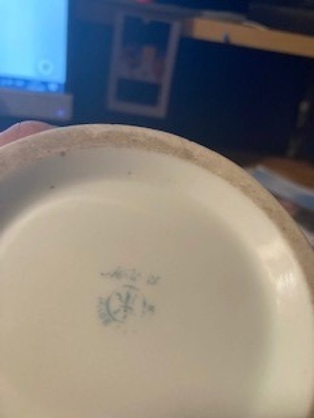 A marking on the bottom of a vase.