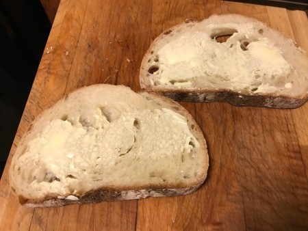 Two pieces of buttered French bread.