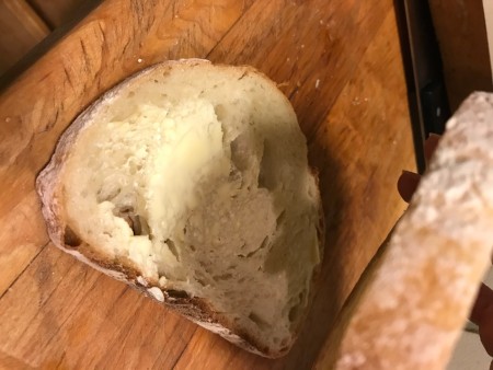 Stacking the buttered pieces together.