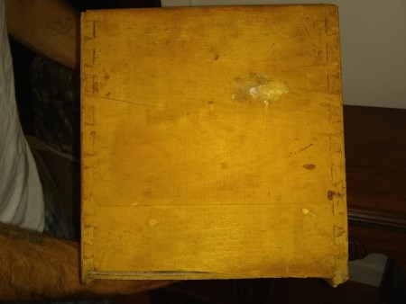 the underside of an old wooden desk.