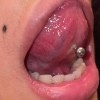 A tongue with a piercing.