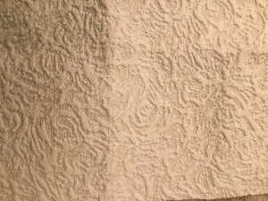 A beige textured wallpaper.