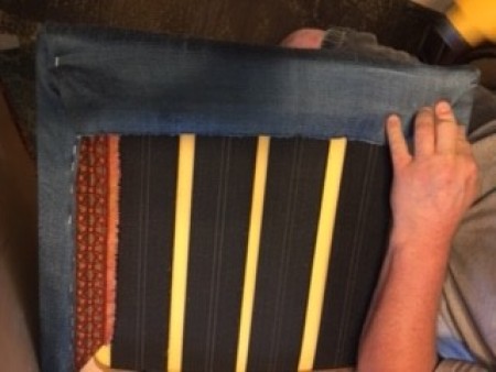 Attaching the upholstery to the back of the chair.