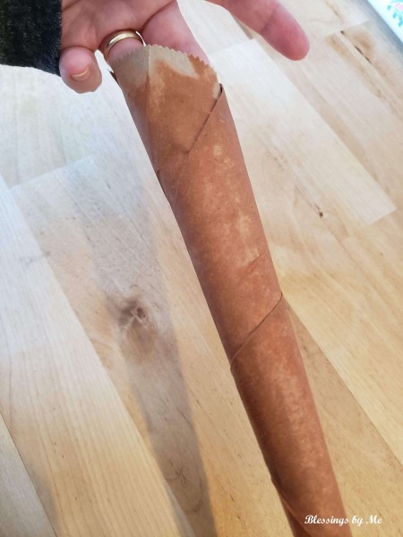 A cone of paper painted ornage.