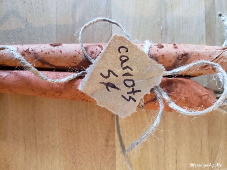 Paper Bag Carrots tied with a string.