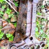 An old and rusty plow hitch clevis.