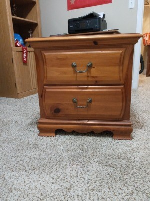 A small wooden nightstand.