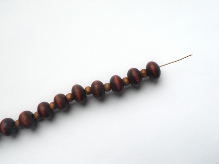 A row of beads on copper wire.