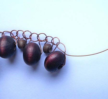 Crocheting the wire bangle together.