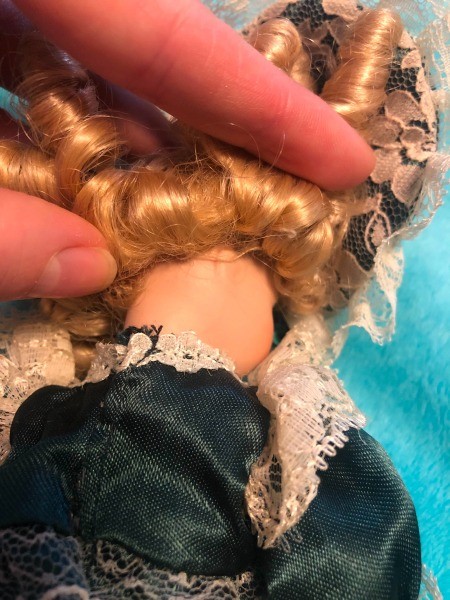 The back of the neck of a porcelain doll.