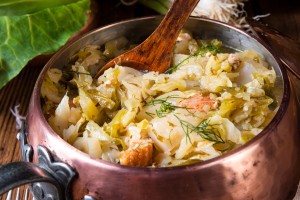 A pot of fried cabbage with bacon.