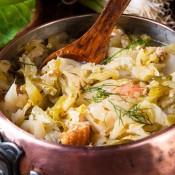 A pot of fried cabbage with bacon.
