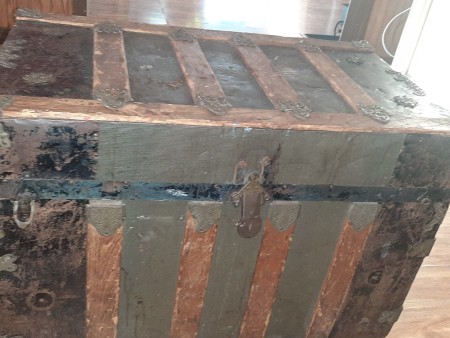 A wooden chest with panels.