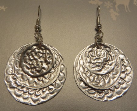 Two completed aluminum earrings.
