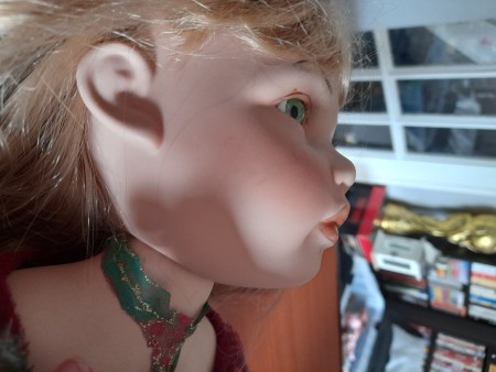 Close up of a porcelain doll.