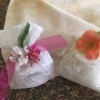 Two completed sachets with decorative flowers.