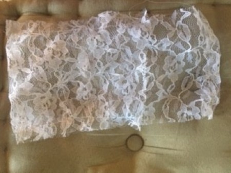 A piece of rectangular lace.