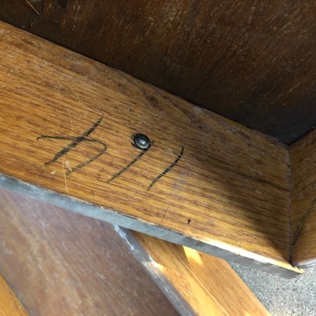 The inside of a wooden drawer.