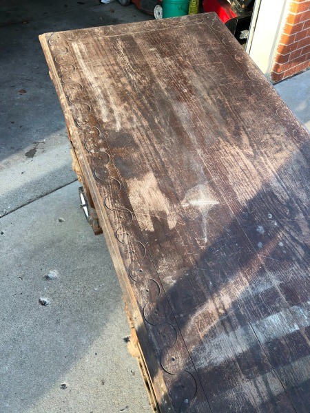 The top of a wooden desk.