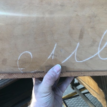 Markings on a wooden desk.