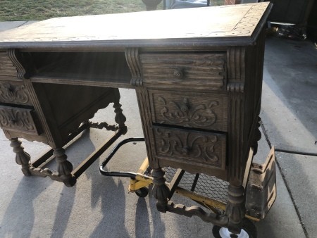 An ornate wooden desk.
