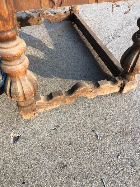 The legs of a wooden desk.