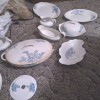 A set of white china with blue flowers.