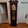 A wooden grandfather clock.