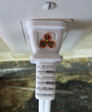 A sticker marking the top of a plug.