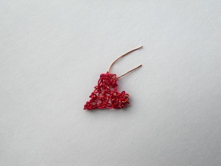 Adding a hanger to the heart pendant.