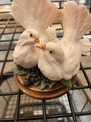 A figurine of two white doves.
