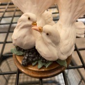 A figurine of two white doves.