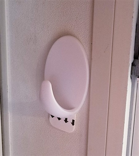 A removable hook on the side of a window.