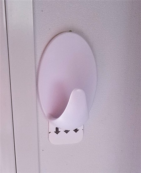 A removable hook on the side of a window.