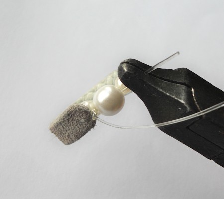 Finishing the leather beaded ring.