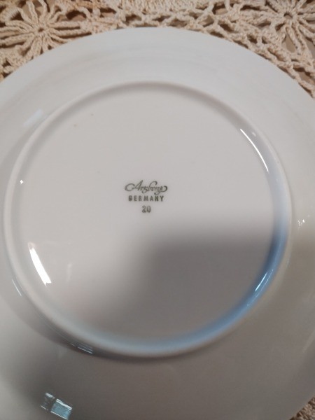 The marking on the back of a dish.