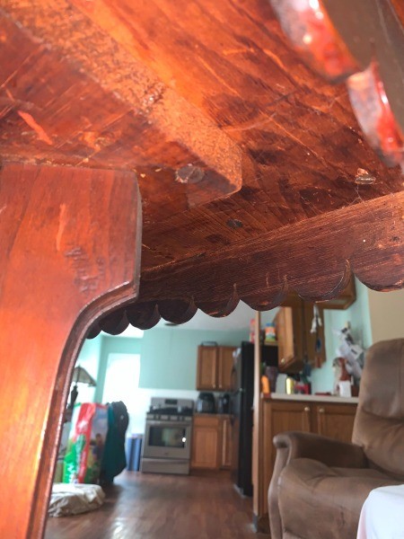 Underneath the game table.