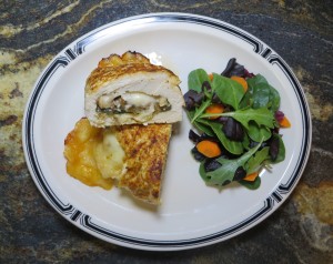 The finished chicken breast with a salad.