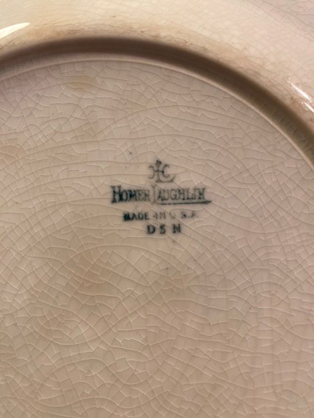 The marking on the back of a plate.