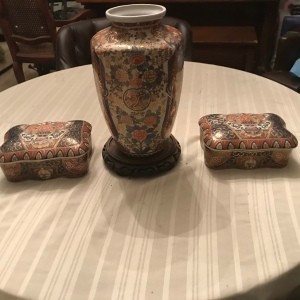 Two china boxes and a vase.