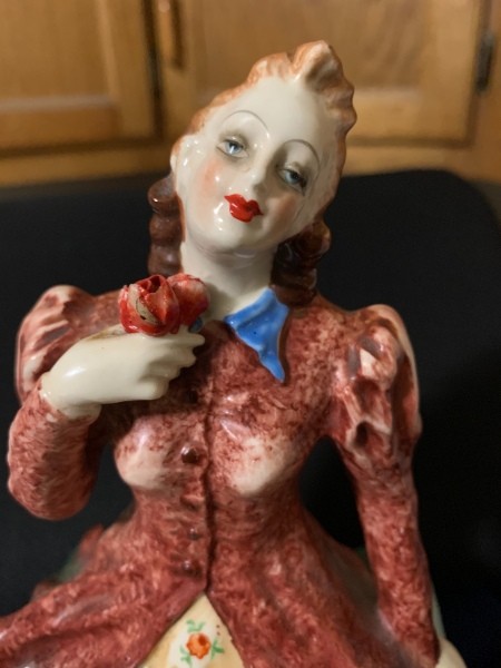 A close up of the front of a figurine.